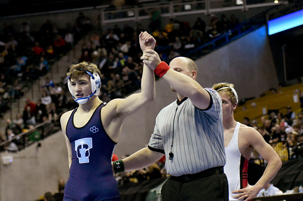 Fr. Tolton Catholic's Brant Whitaker is declared the winner over Drayton Harris of Gallatin